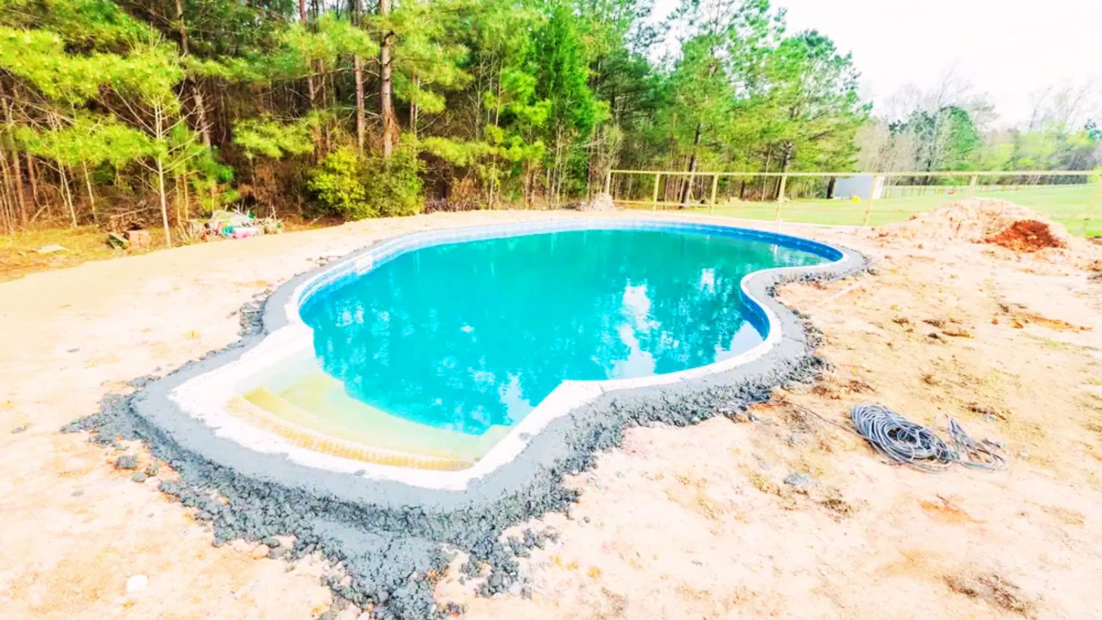 Final testing and filling of a newly built swimming pool.